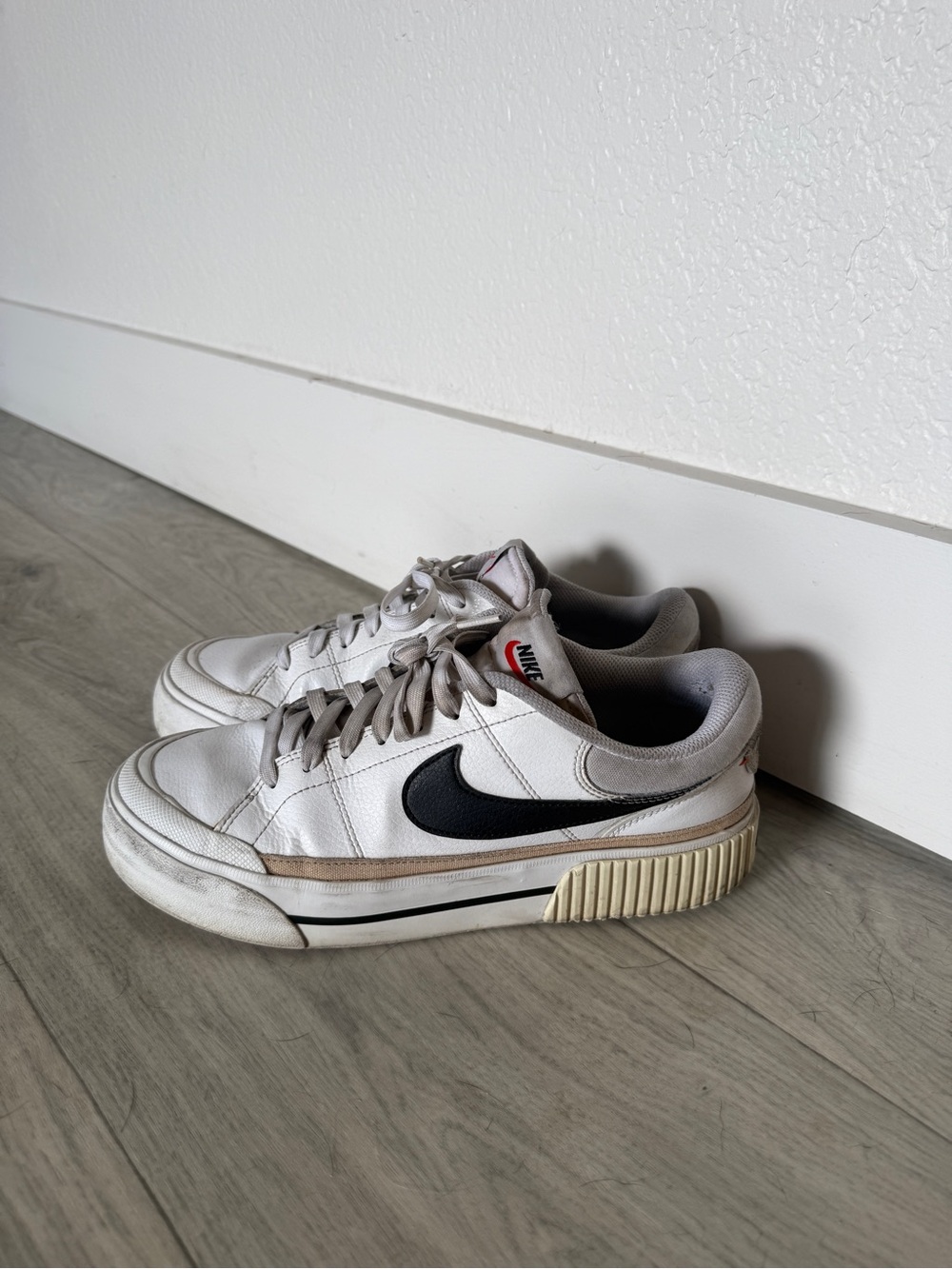 Nike White Low-Top Sneakers Platform with Black Swoosh and Cream Sole Accents